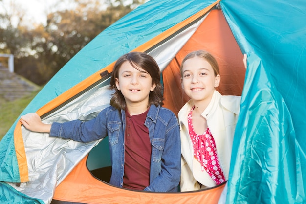 Happy friends spending the day together in the tent