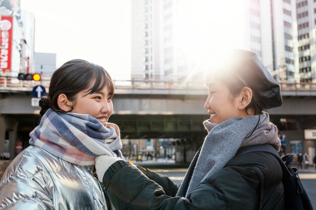 Happy friends spending time together outside