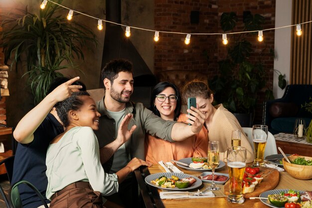 Happy friends taking selfie medium shot