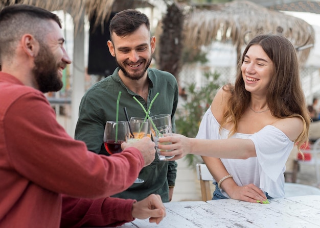 Happy friends toasting medium shot