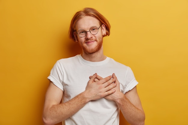 Happy ginger hipster with bob hairstyle, beard and moustache