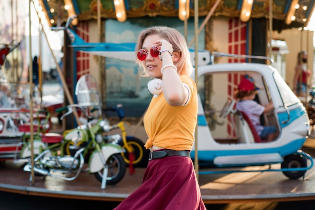 Free photo happy girl at amusement park