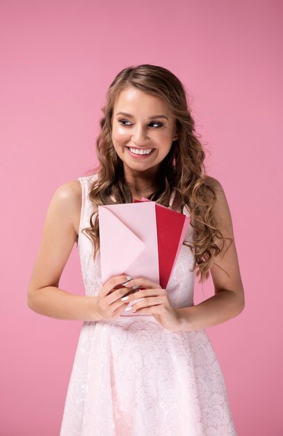 Happy girl holding some love letters