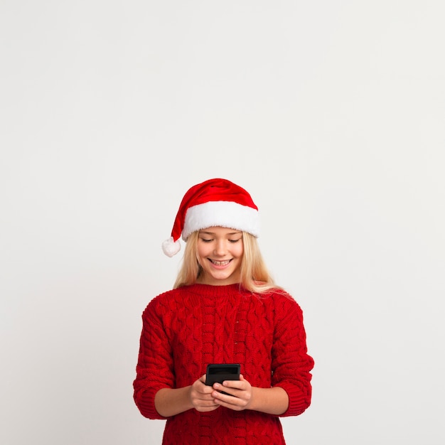 Happy girl looking at phone