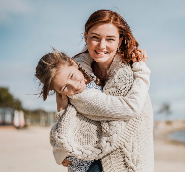 Happy girl and mother having fun together