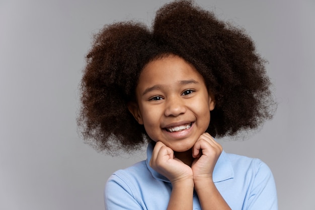 Free Photo happy girl with adorable hair smiling