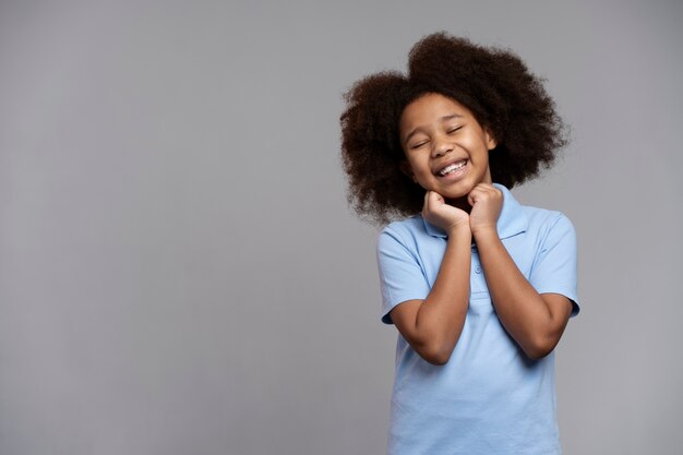 Happy girl with adorable hair smiling