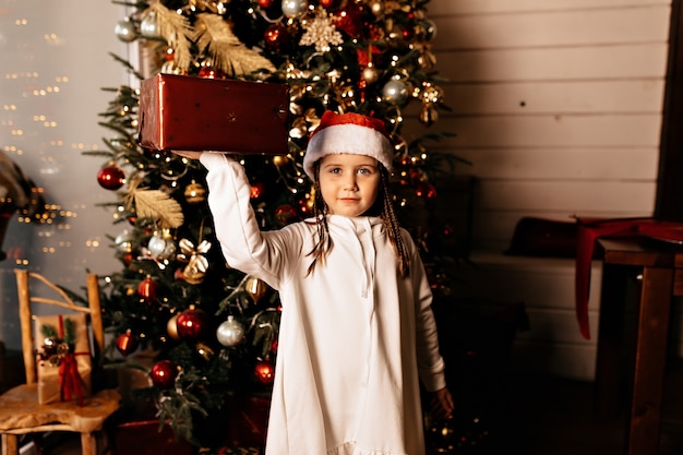 Free photo happy girl with christmas present