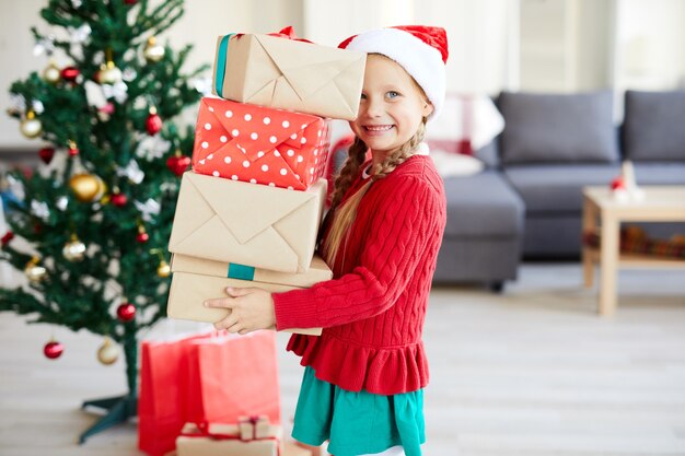 Happy girl with christmas presents