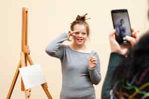 Free photo happy girl with down syndrome posing