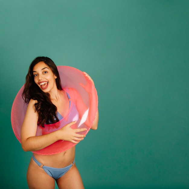 Free photo happy girl with inflatable ring