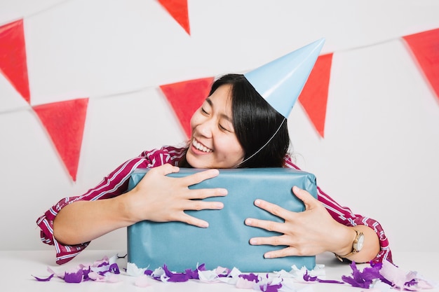 Happy girl with present box