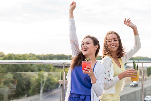 Happy girls dance at a party