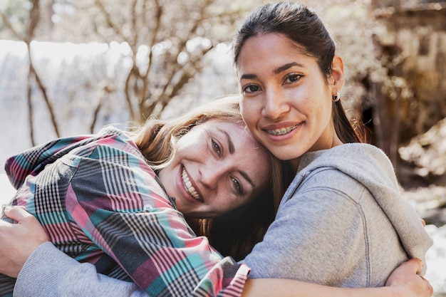 Free Photo happy girls hugging each other