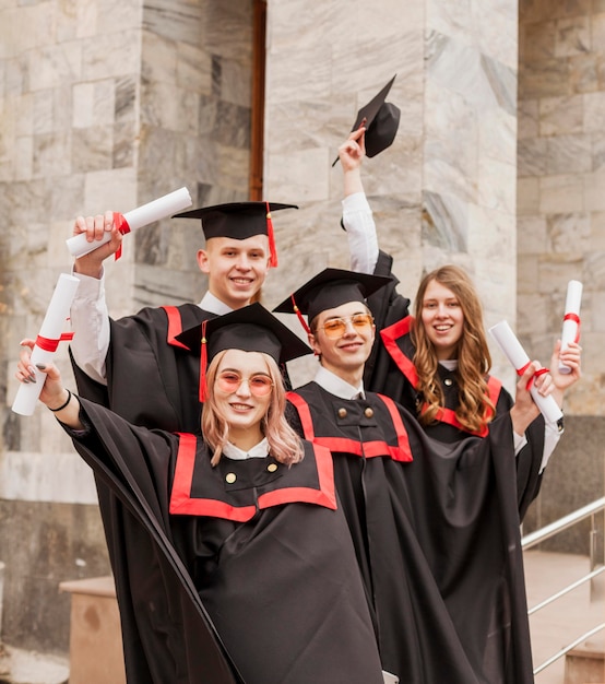 Free photo happy graduated students