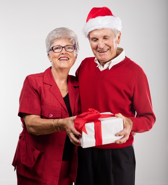 Happy grandparents with gifts