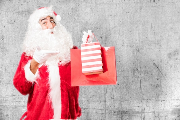 Free Photo happy guy showing his christmas bags