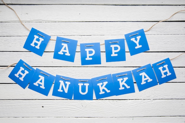 Happy Hanukkah garland on table