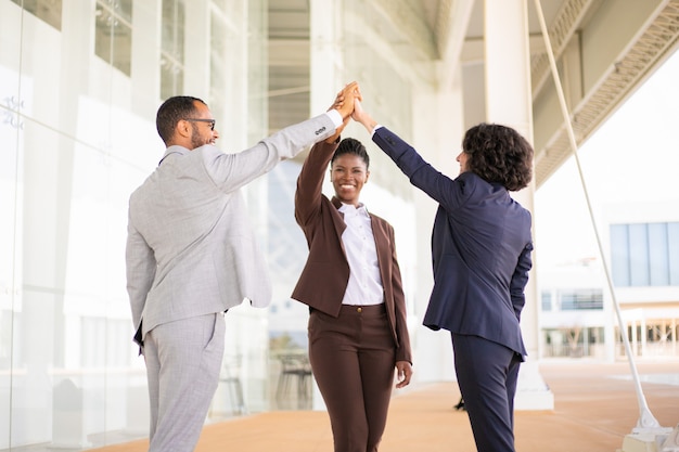 Happy joyful business colleagues celebrating success