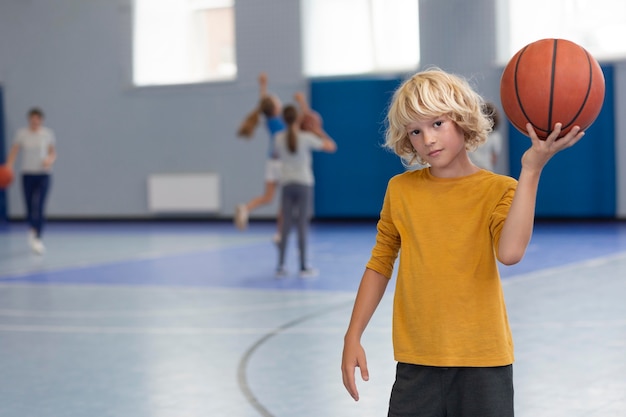 Free photo happy kid enjoying his gym class