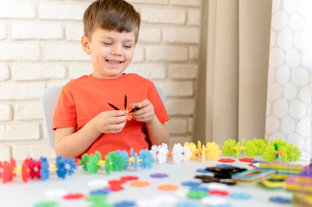 Happy kid with plastic toy