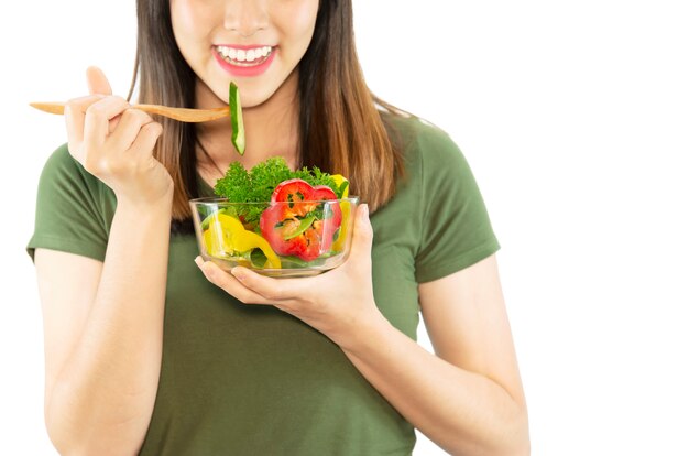 Happy lady enjoy eating vegetable salad 