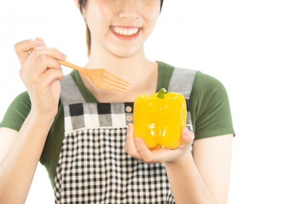 Happy lady holding kitchen stuff over copy space background 