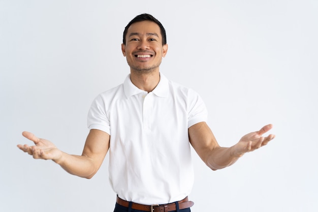 Happy Latin guy outstretching hands and ready to hug