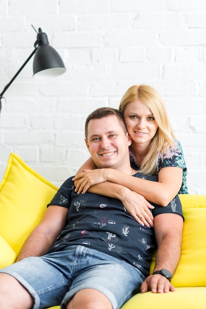 Free photo happy loving couple looking at camera