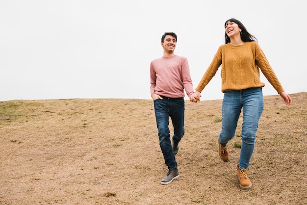 Free Photo happy loving couple walking in nature