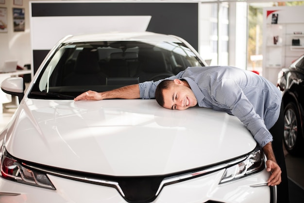 Happy man celebrating his new car