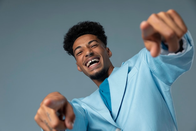 Happy man with blue shiny jacket