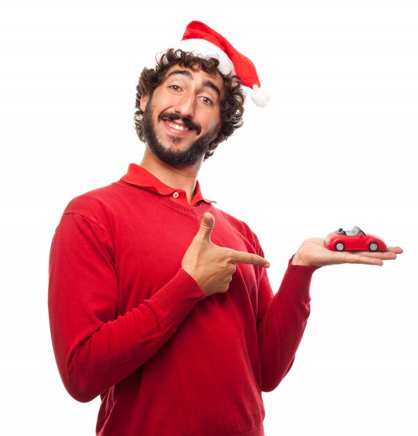 Happy man with a car and a santa hat