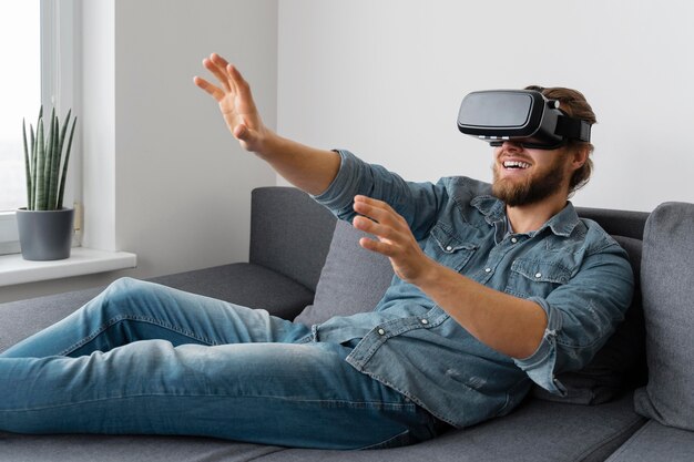 Happy man with vr glasses medium shot