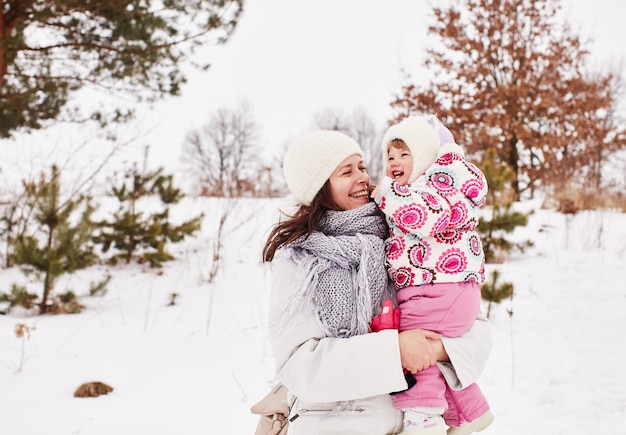 Happy mother and baby are smiling and hugging