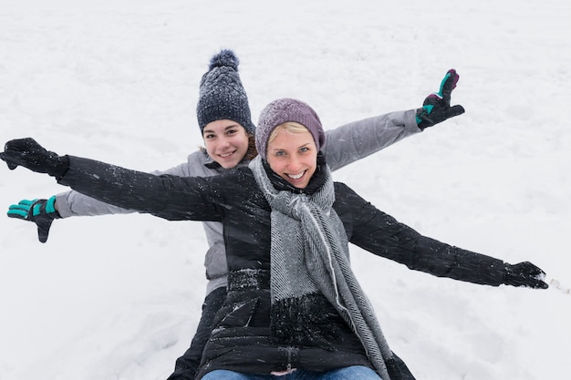 Free Photo happy mother with her beautiful daughter enjoying winter vacation