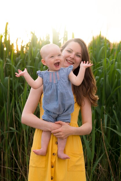 Happy mother with kid in nature