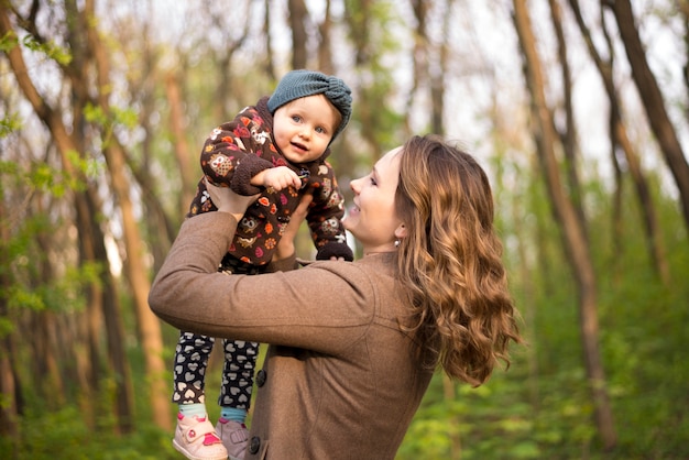 Happy mother with kid in nature