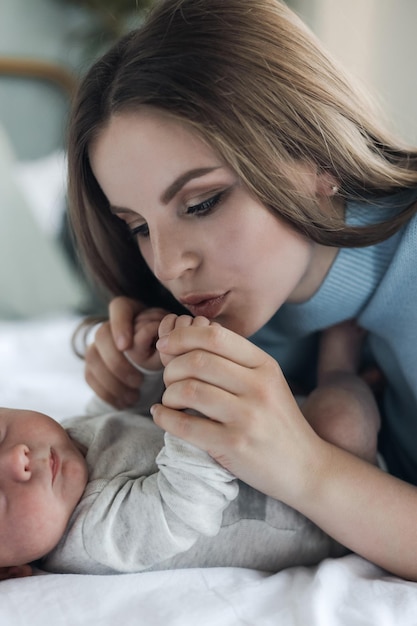 Free photo happy mother with newborn at home