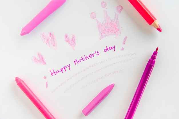 Free photo happy mothers day inscription with drawings and pencils