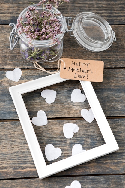 Free Photo happy mothers day inscription with flowers, hearts and frame