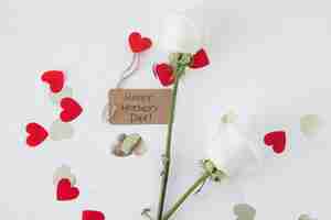 Free photo happy mothers day inscription with roses and hearts