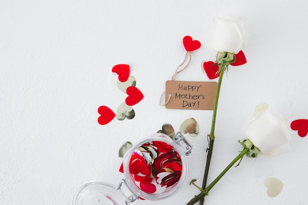 Free Photo happy mothers day inscription with roses and paper hearts