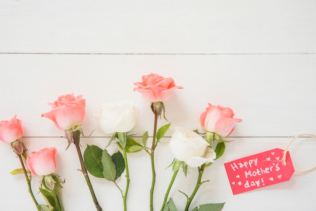 Free Photo happy mothers day inscription with roses 