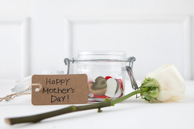 Happy Mothers Day inscription with white rose 