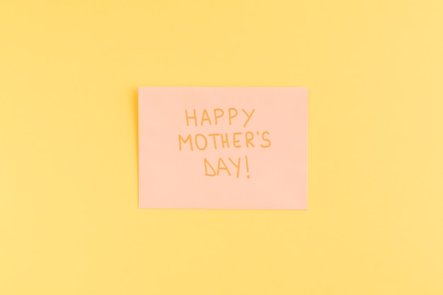 Happy mothers day title on pink paper