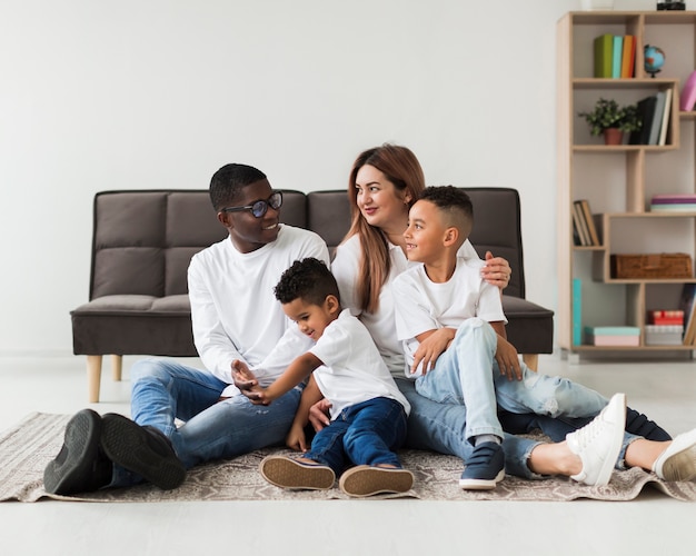 Free photo happy multicultural family having fun together indoors