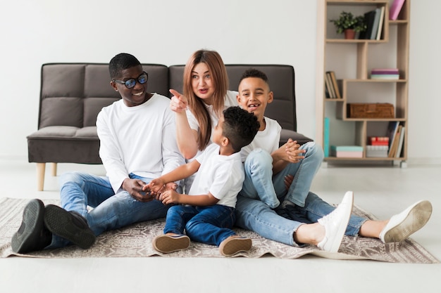 Free photo happy multicultural family having fun together