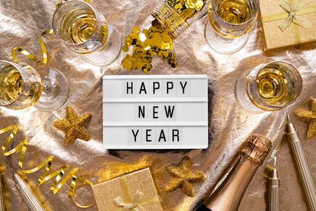 Free photo happy new year quote plate with golden decor