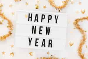 Free photo happy new year sign with decoration